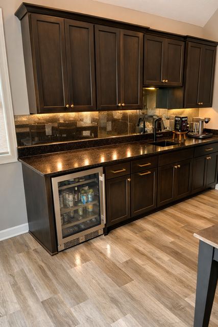 Wet bar with an antique mirror backsplash under the cabinets