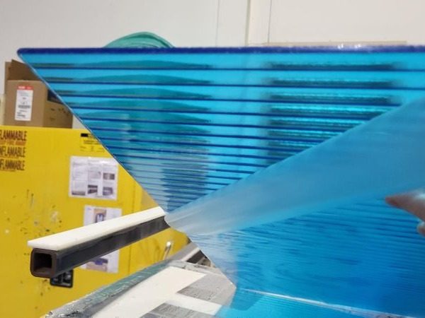 Reeded glass back-painted in transparent blue