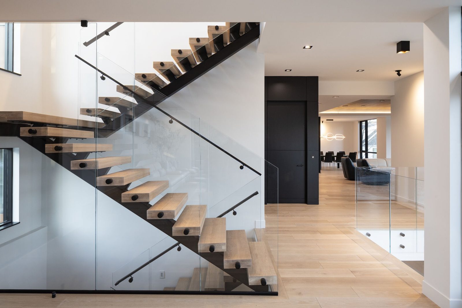 Frameless glass railing along an open staircase