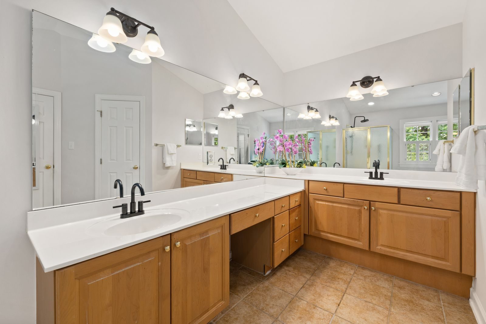 Long vanity mirror spanning a double vanity